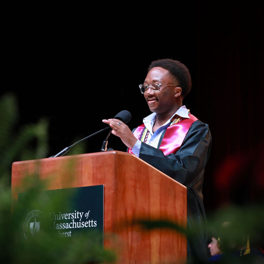 UMassJournalism's tweet photo. From beanies to bucket hats to bandanas, Journalism and @umasspolsci major Tanyi Muanya stepped into his grad cap era during his speech at the @UMassCHC Celebration of Excellence. Tanyi – thank you for sharing your story with the Class of 2024 🎓 #UMassJournalism https://t.co/AyxGA6OAsj