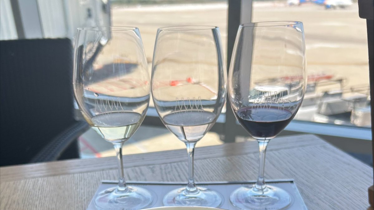 Cheers to National Wine Day! 🍷 Celebrate the day by enjoying a nice glass of wine at @vinovolo's Concourse A or Concourse B location before you fly out! #NationalWineDay #Wine #Travel