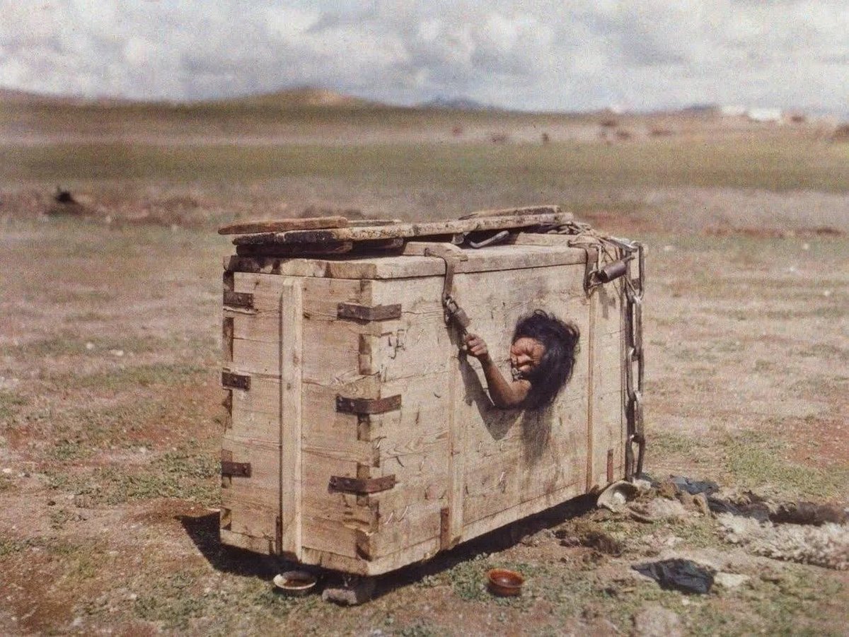 7. Mongolian punishment, woman condemned to death is locked in wooden crate to slowly starve. 1913.