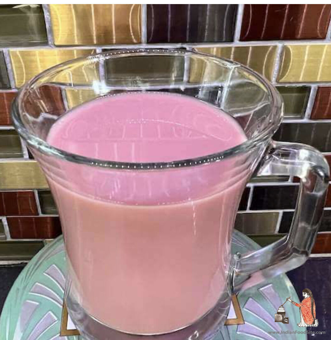 Kashmiri tea is a traditional beverage from the India. This bright tea is made with gunpowder tea, milk and baking soda. A process of making this tea might take 30 minutes or even 40 minutes. If all water has evaporated and still you don't get a reddish color then add more water