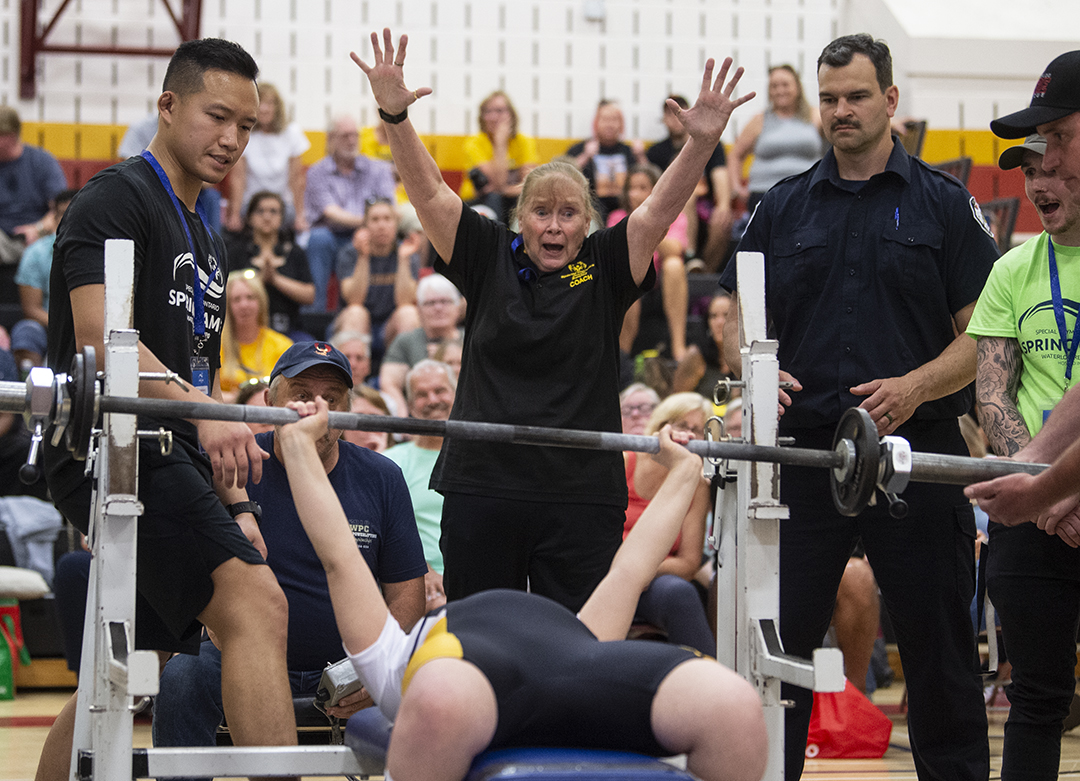 Coach Dianne MacKeigan celebrates as she watches Mia Belluz successfully complete her bench press during the #specialoympics powerlifting competition at Resurrection Catholic Secondary School, Friday, May 24, 2024.