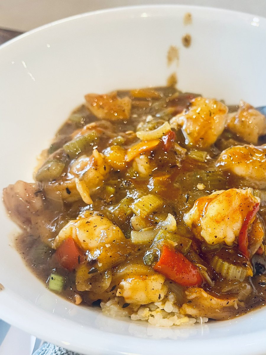 Shrimp etoufee with egg fried rice.