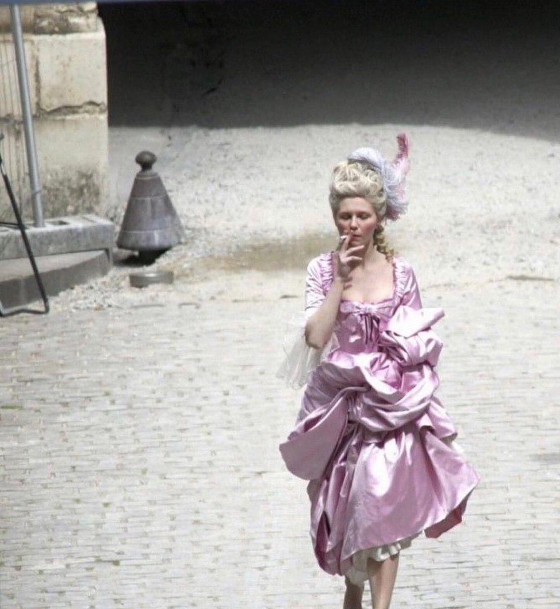 10 behind-the-scenes pictures from movie sets: 1) kirsten dunst smoking on the set of 'marie antoinette'