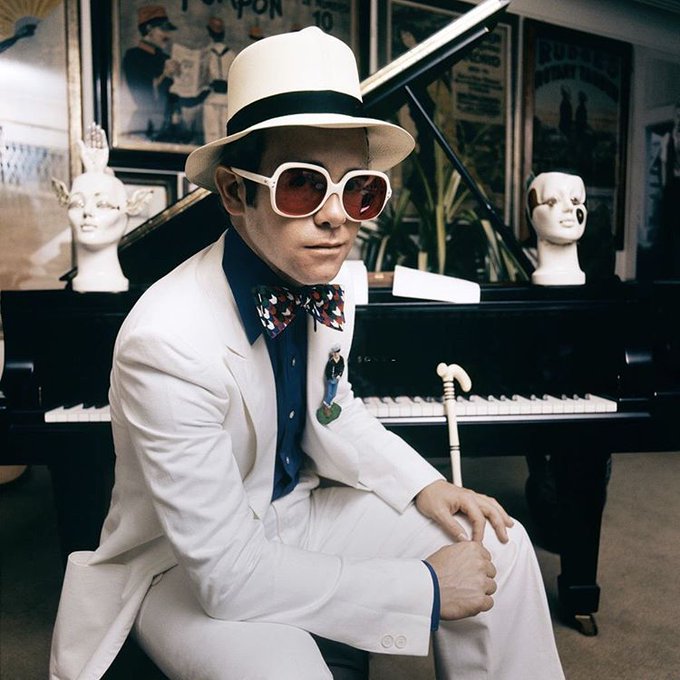 Elton John at his home in Wentworth, Surrey, during a shoot for the cover of 'Elton John's Greatest Hits', 1974. Photo by Terry O'Neill.