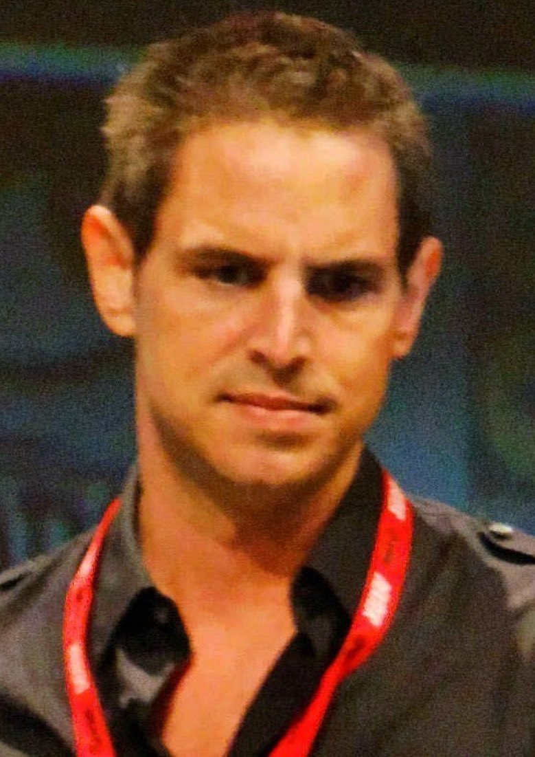 Queer Figure Gregory Berlanti (born May 24, 1972)screenwriter, producer and director of film and television. He is known for his work on the television series Dawson's Creek, Brothers & Sisters, Everwood, Political Animals, Riverdale, Chilling Adventures of Sabrina and You, in
