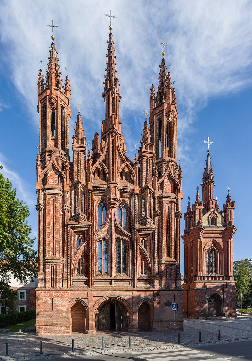 In the Late Middle Ages there was a phase of architecture known as "Brick Gothic", which is exactly what it sounds like.

The best example is probably the Church of St Anne in Vilnius, Lithuania, completed in 1500.