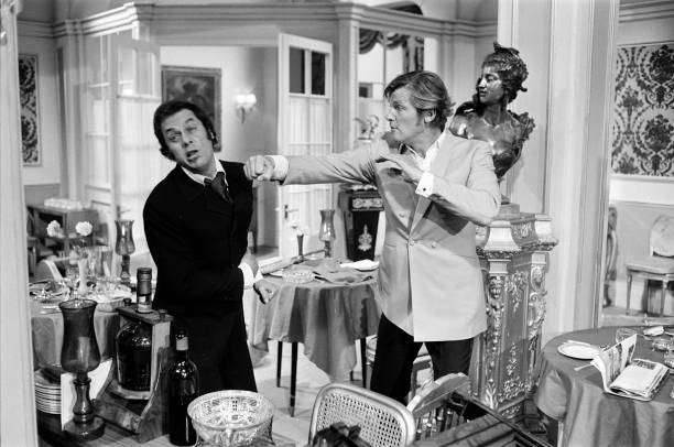 RodneyMarshall1's tweet image. Tony Curtis and Roger Moore practise for their bar brawl in the introductory episode, Overture. As producer Bob Baker observed: &quot;You have these two guys fighting over how many olives you have in a drink; certainly, you&apos;re not going to take it seriously from that point onwards.&quot;