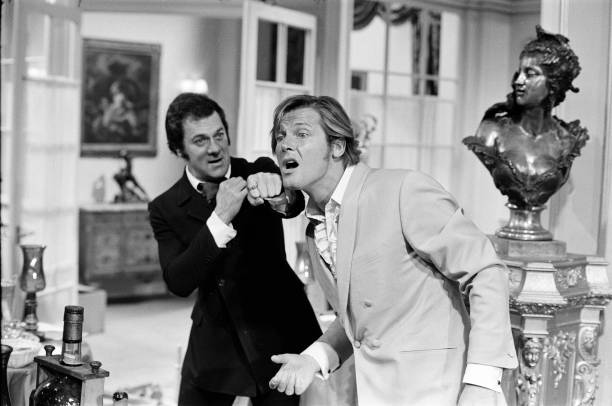 RodneyMarshall1's tweet image. Tony Curtis and Roger Moore practise for their bar brawl in the introductory episode, Overture. As producer Bob Baker observed: &quot;You have these two guys fighting over how many olives you have in a drink; certainly, you&apos;re not going to take it seriously from that point onwards.&quot;