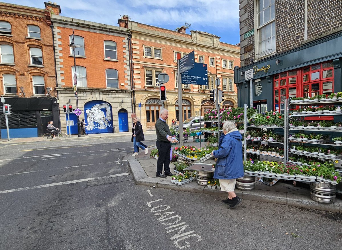 We need more street corners like this; road engineer's nightmare, living city dream