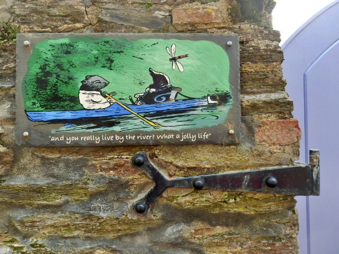 A sign on a wall near the River Fowey in Cornwall. Have a jolly life too!