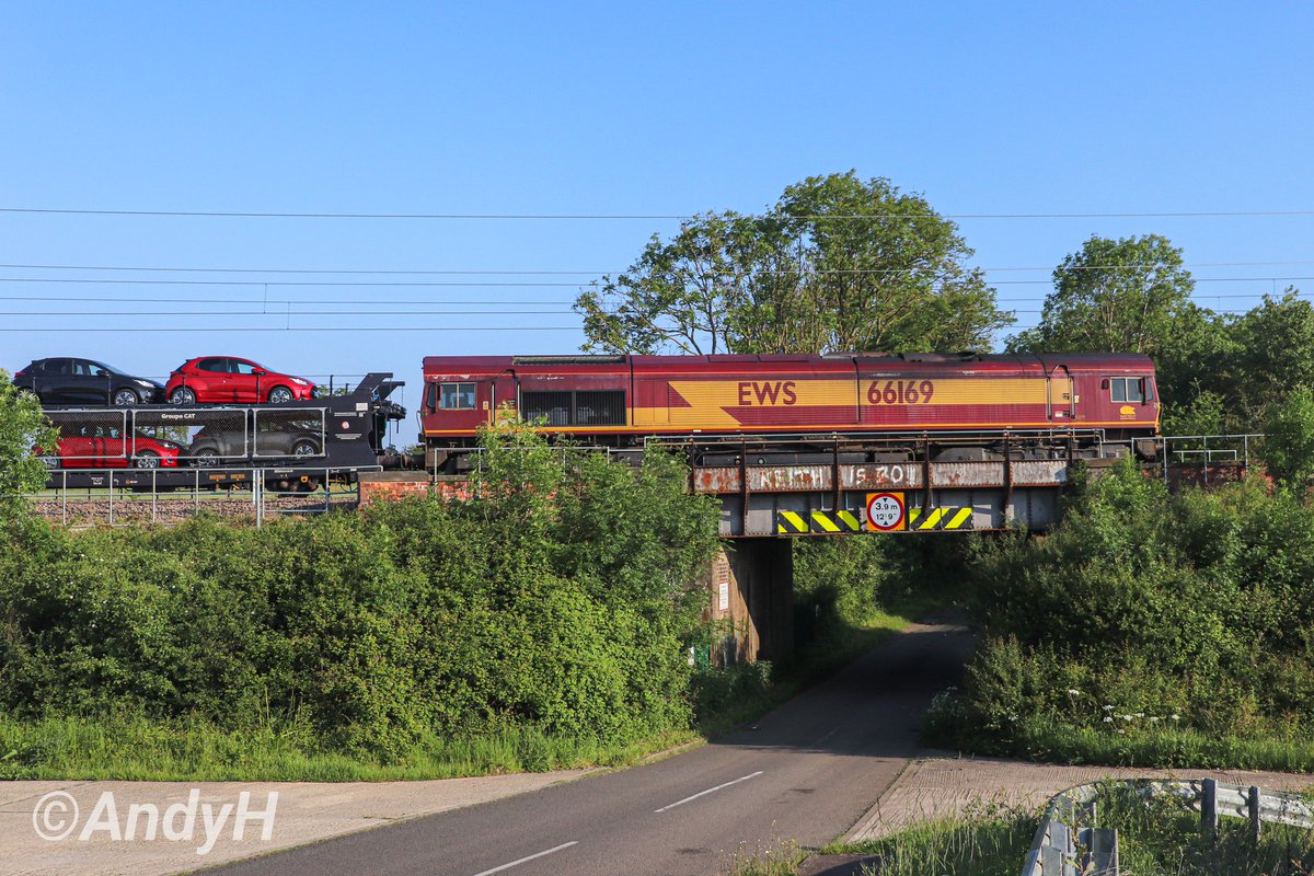 #SaturdayShedWatch from sunny Northamptonshire this morning. Original #EWS branded @DBCargoUK 66169 heads towards Corby with the #ToyotaTrain, 6X13 Dollands Moor to Toton North Yard with imported cars. Seen passing Great Oakley #SideOnSaturday #DBCargo 25/5/24