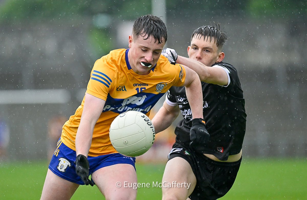 Clare’s Conor Burke in action against Dante Currid from Sligo. HT in the preliminary QF of the All-Ireland Tier 2 football championship it’s @GaaClare 0-5 @sligogaa 2-6. Photograph by @eugemccafferty.