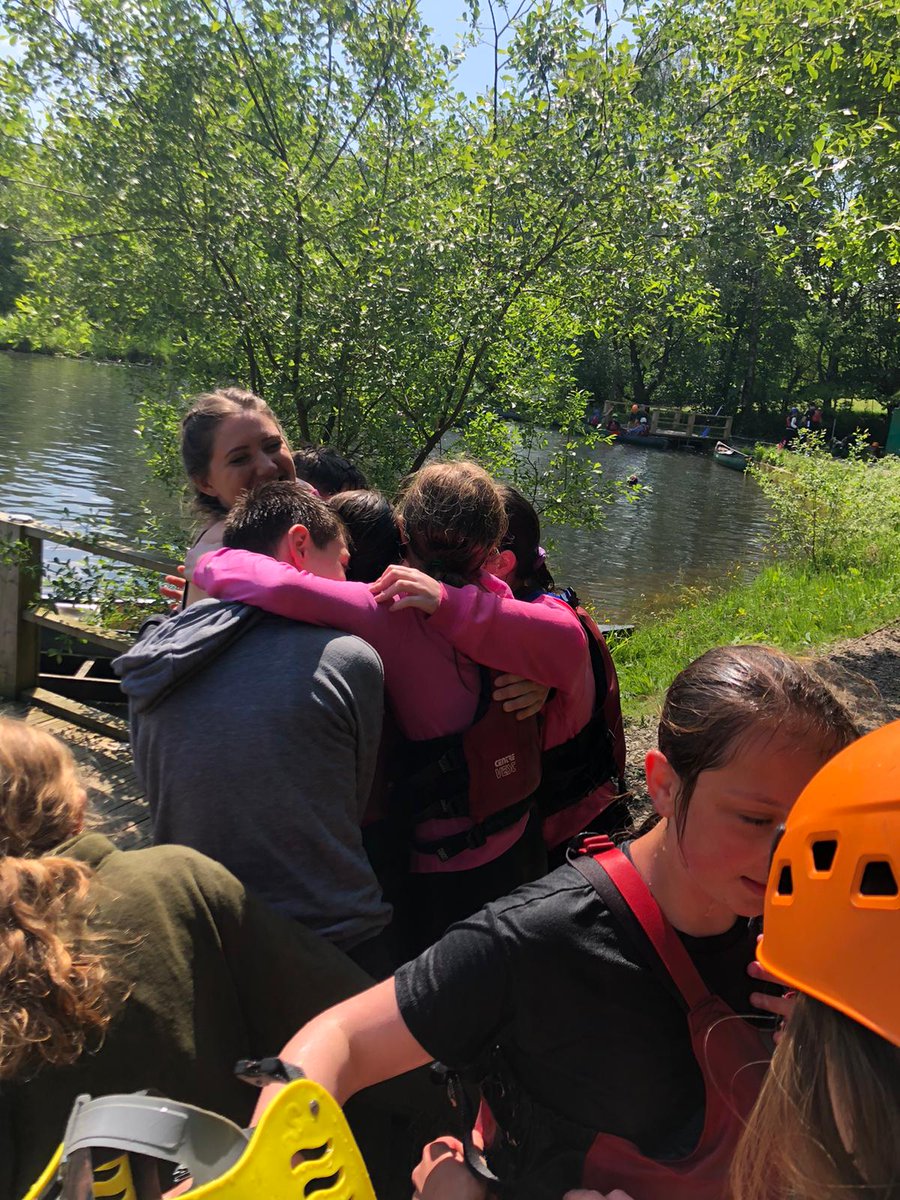 Mrs Kelly didn't escape a soggy group hug after the children dived into the lake, following raft building.
