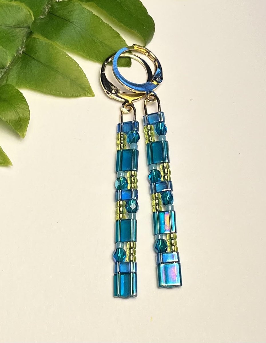 Vibrant Luminous Stacked Dangle Earrings! Lightweight Miyuki Tila glass beads intermingled with faceted Czech glass and seed beads. A big impact in a small statement! Fat Birds Flight on Etsy. fatbirdsflight.etsy.com #jewelry #earrings #madeinwisconsin #shoplocal