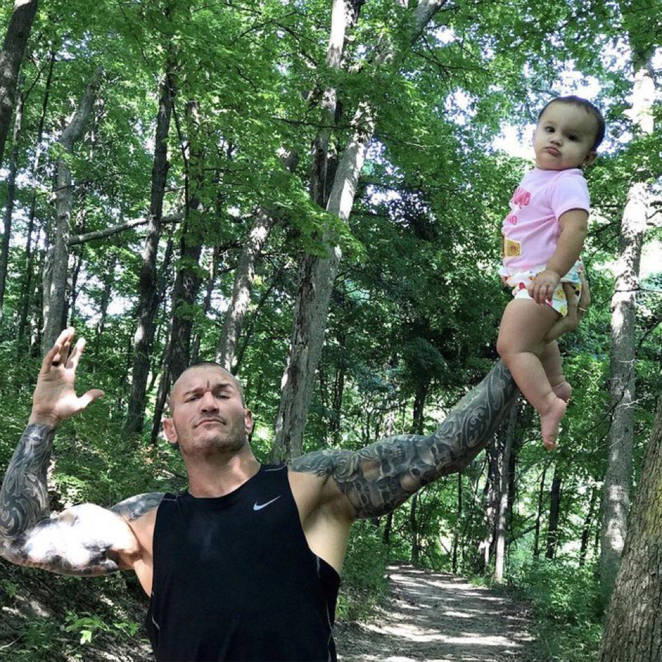 Randy Orton holding his daughter up mid pose. Might be one of the best photos we’ve ever seen 😭