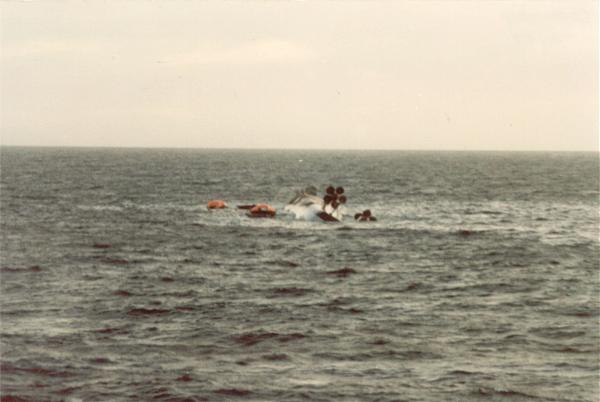 May 25th 1982: The last of HMS Coventry, rolled completely over with her propellers visible and life rafts around her. Waiting for pickup, the crew now gave a stirring rendition of that great British anthem, "Always look on the bright side of life."