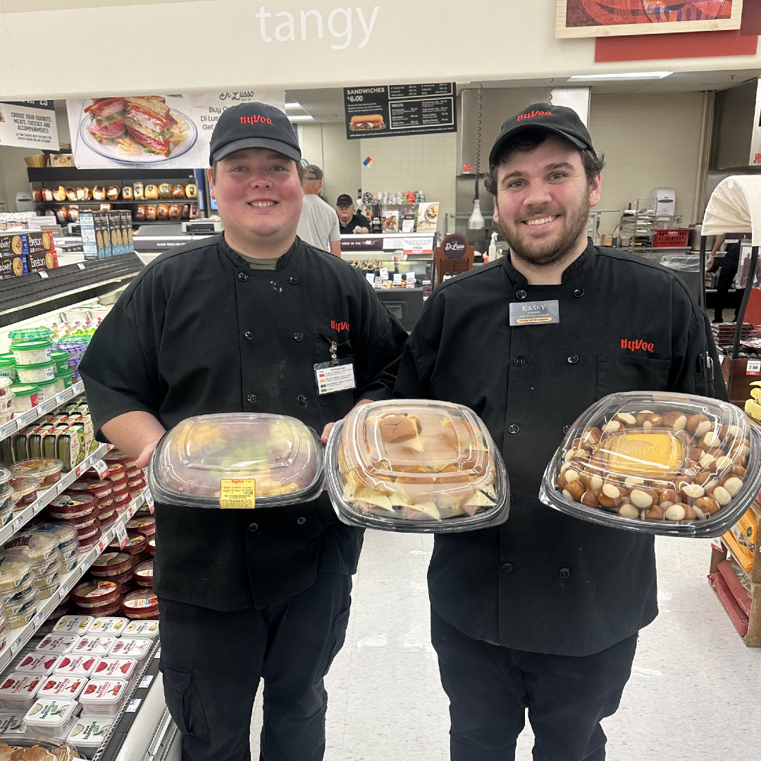 Kasey & Cade are stacked for all your party needs! 🇺🇸 🎓Grab n go party trays ready right in front of our deli counter. Save time and enjoy your celebration 🎊 #indianolahyvee