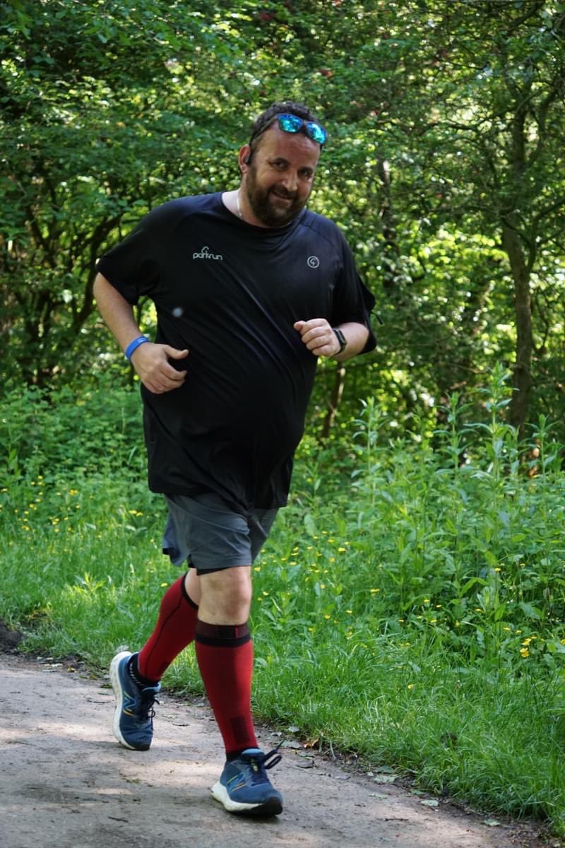 An actual half-decent pic of me running! Still a fat git but lapping all the other fat gits on the sofa! #thisfatladcan #gettingfitter @parkrunUK 🧡