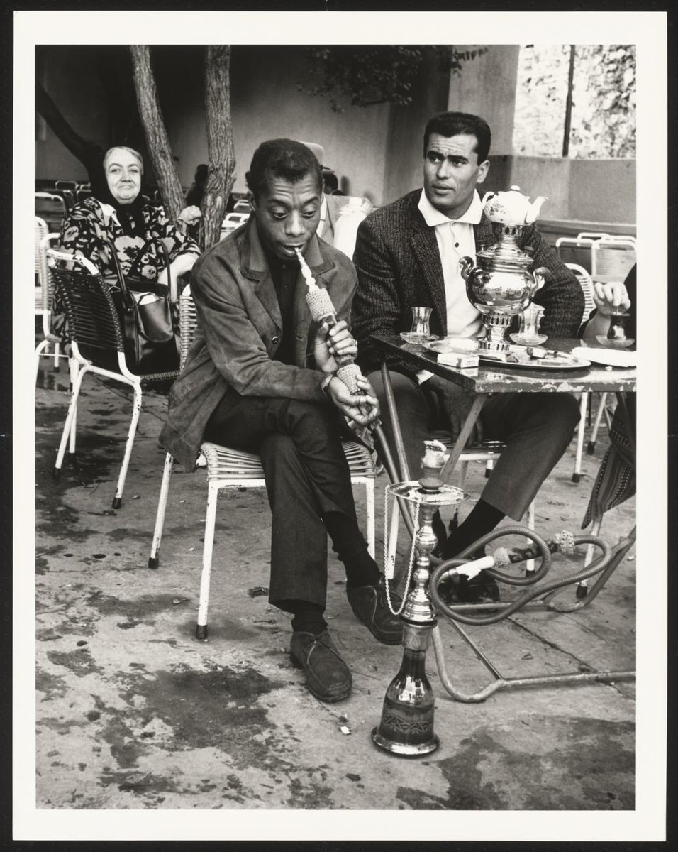 James Baldwin in Emirgan tea house trying hookah, Istanbul, 1965.