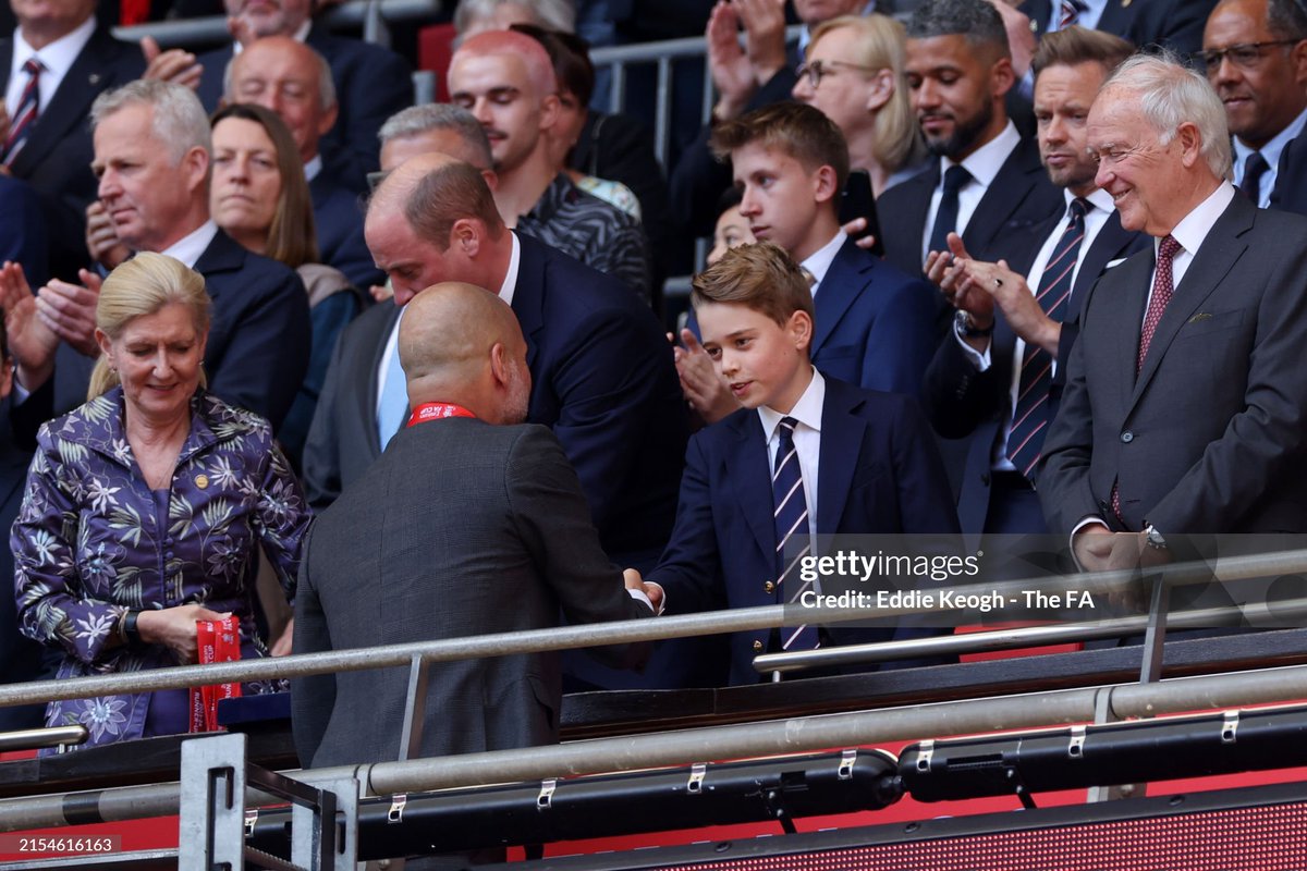 Erling Haaland shakes hands with Prince William, and Prince George shakes hands with Pep Guardiola after the Emirates FA Cup Final match between Manchester City and Manchester United
