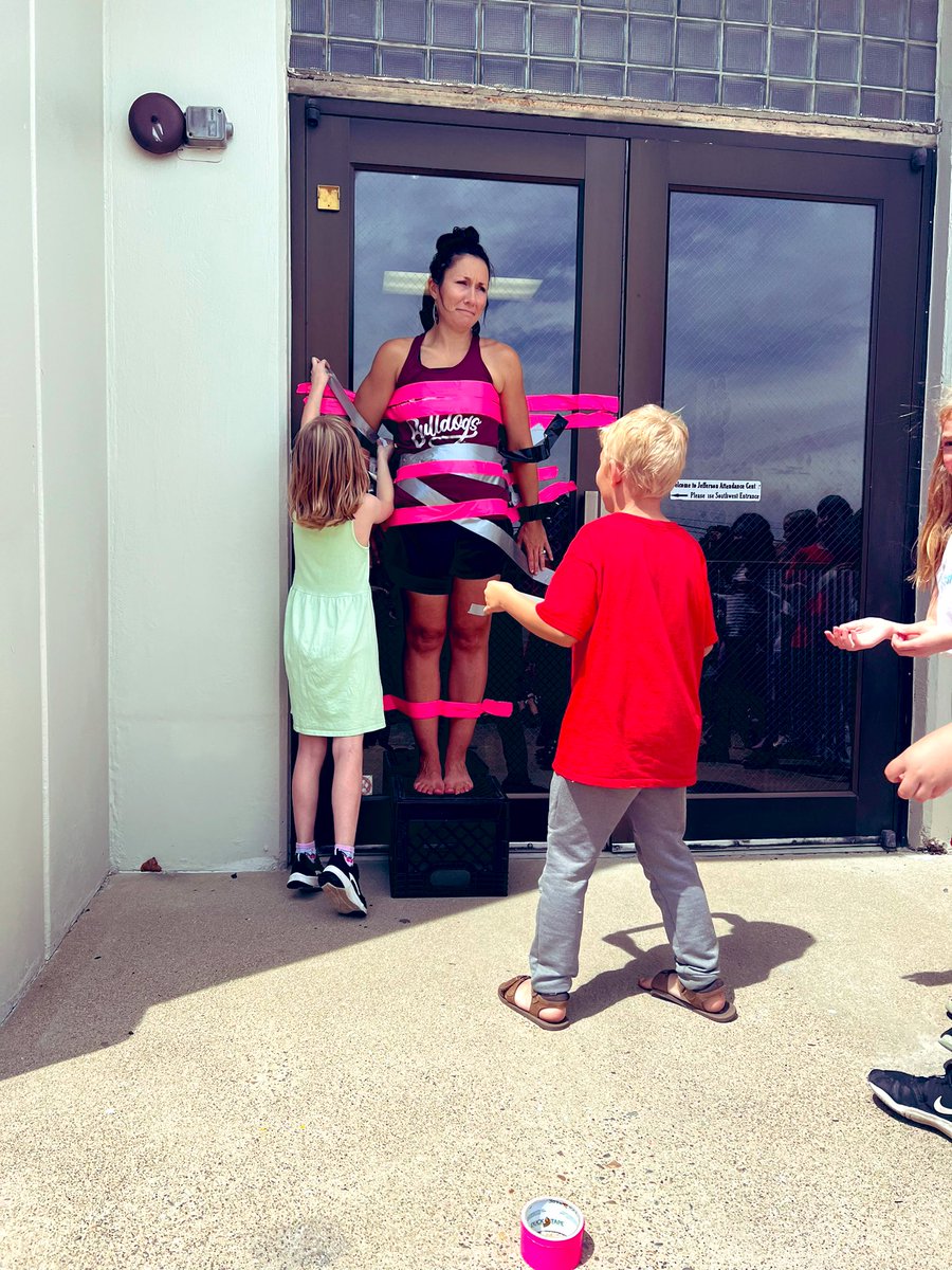 MrsLaceyMoore4's tweet photo. When you meet your school improvement goal in reading and math @Jefferson_Carmi , you tape MOORE TO THE DOOR! Wish I would have worn long sleeves and pants! 😳 https://t.co/6eLuZ39MCi