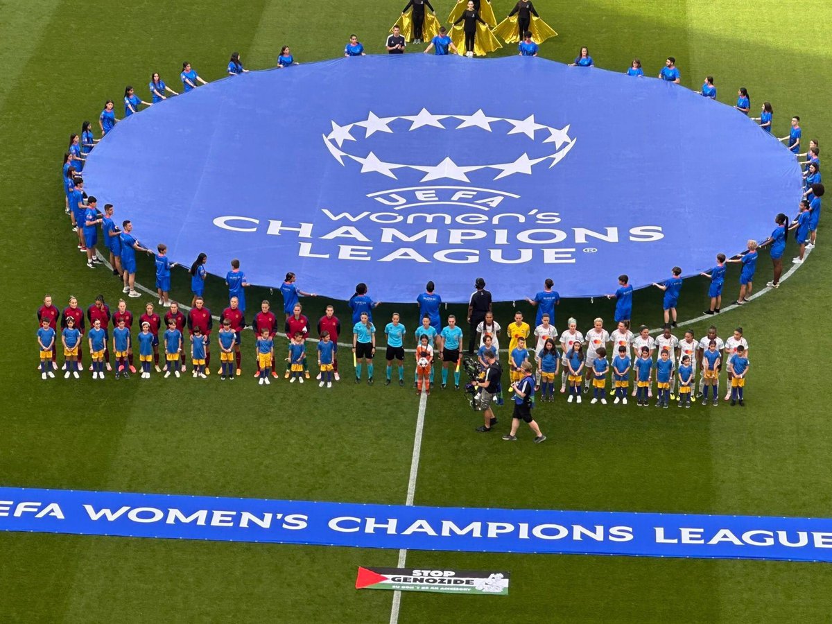 InsiderWorld_1's tweet photo. A "Stop Genocide" banner, featured written on the Palestinian flag, has been placed on the field at UEFA Women’s Champions League Final between FC Barcelona and Olympique Lyon. https://t.co/Jr2oSdZkGj