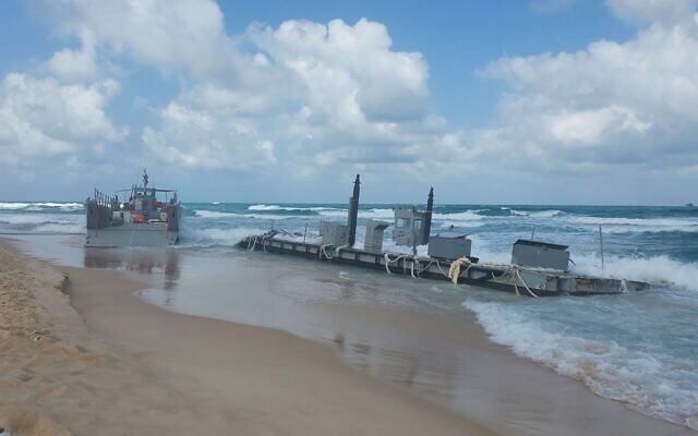 US ships used to deliver aid to Gaza pier have run aground on beach