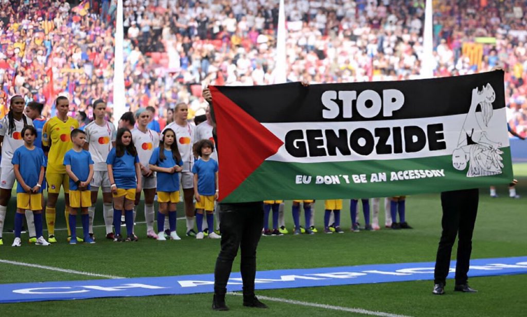 Prior to the ‘Women’s Champions League’ final, a ‘Stop Genocide’ banner is displayed before the stadium’s crowd and the cameras #FreePalestine