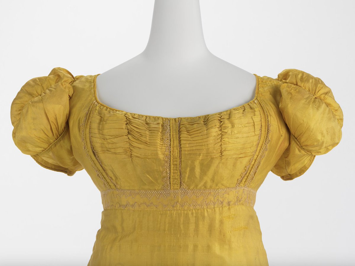 LaurenCDeutsch's tweet photo. #Ootd is this 1804-15 gown. It has the typical high-empire waist of the Regency period, but there are some more interesting features, like the gathers in the back that make a slight train and the Renaissance-inspired sleeves. So gorgeous. #YellowMay @metmuseum #Fashionhistory https://t.co/v97kYNh2rV