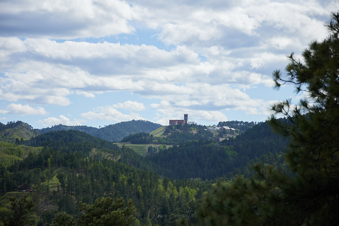 Just above Deadwood, South Dakota and behind the building you see in the distance are the remnants of an old gold mine where William Randolph Hearst's family became rich from gold prospecting. They then moved out to California and built Hearst Castle.