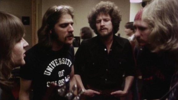 Eagles warming up their vocals backstage before a concert, 1977