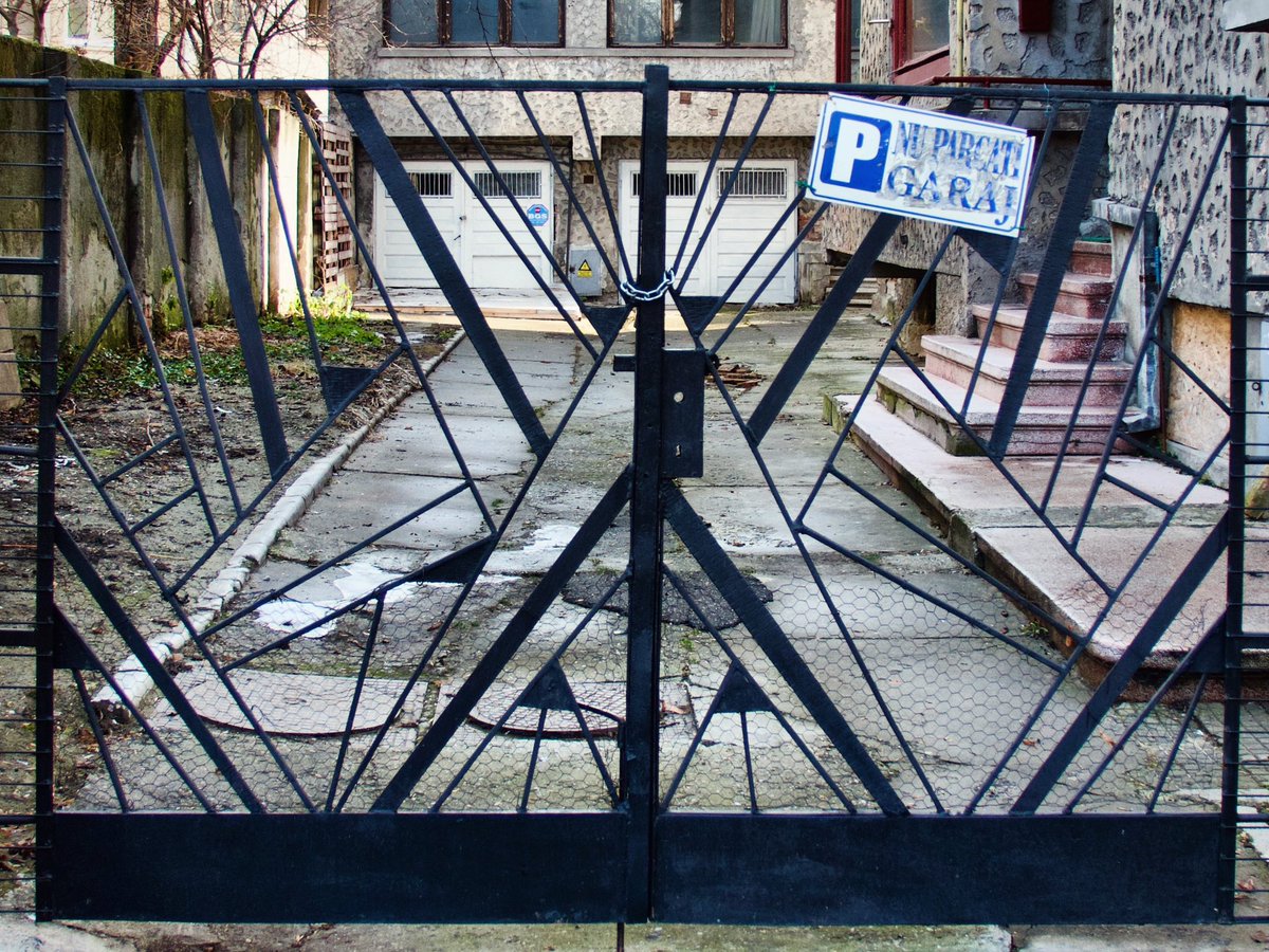 The high quality design of 1930s Art Deco gates in Cotroceni quarter of Bucharest, sporting the spiderweb motif, a symbol of the homemaker. #spiderweb #artdeco #gates #cotroceni #bucharest #balkans #southeasteurope #casedeepoca #valentinmandache