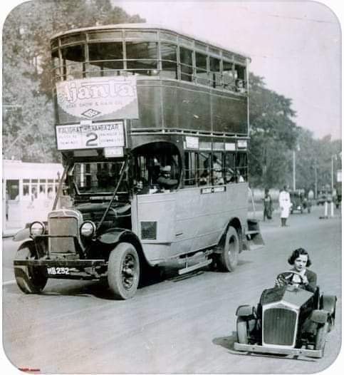 The Smallest Car in the World Near a Double Decker Bus in Calcutta in 1935. 
Photo credit  ---  Getty lmages.