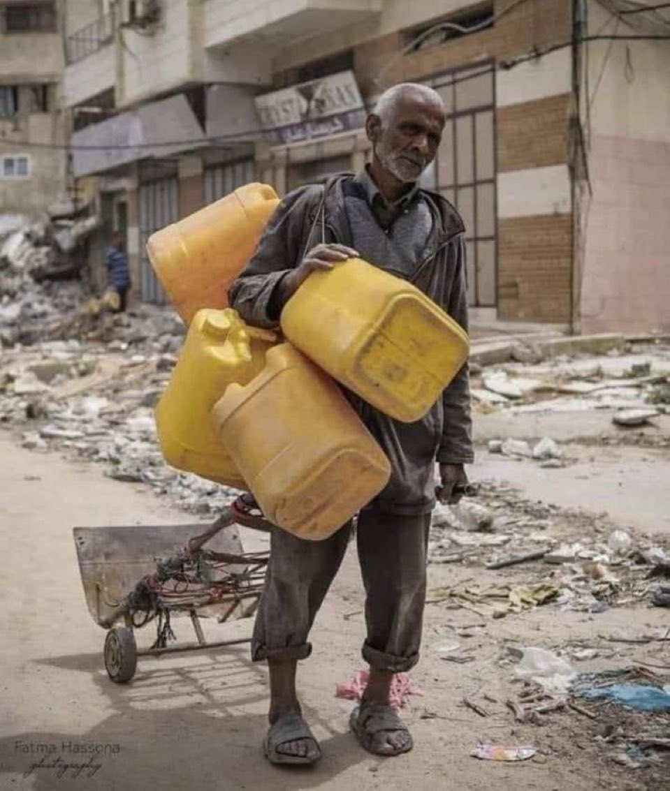 Elderly Palestinian man desperately searching for drinkable water for his family in Gaza.