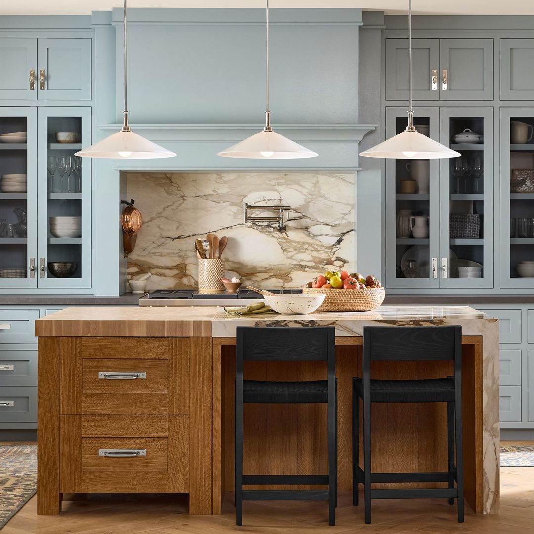 #DesignInspiration - To create a visually striking and elevated kitchen design, consider balancing vibrant blue cabinetry with the warm, natural tones of wood elements. This colour pairing offers a sophisticated and harmonious aesthetic. PC: Rejuvenation Home
