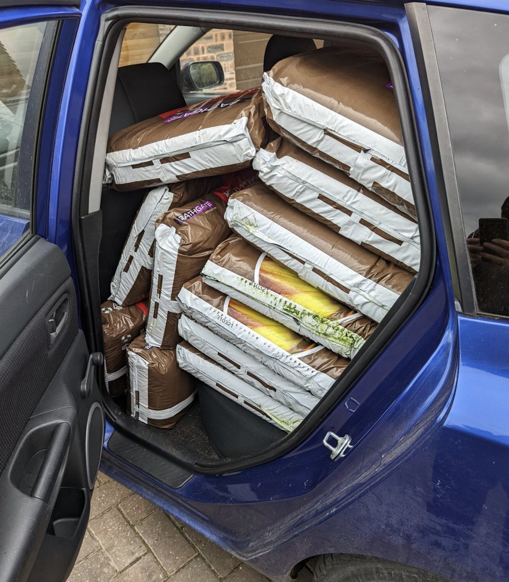 RogueCode's tweet image. Lol an old Mazda can carry over 30 bags. This is a REAL truck.