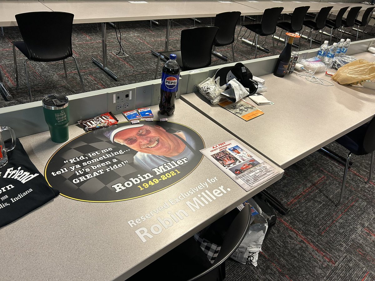 This is the spot forever reserved in the @IMS media center for Hall of Fame motorsports journalist Robin Miller. He died in 2021. People stop by and drop off some of his favorite things like Pepsi, M&Ms, and a shirt commemorating his favorite restaurant…The Workingman’s Friend.