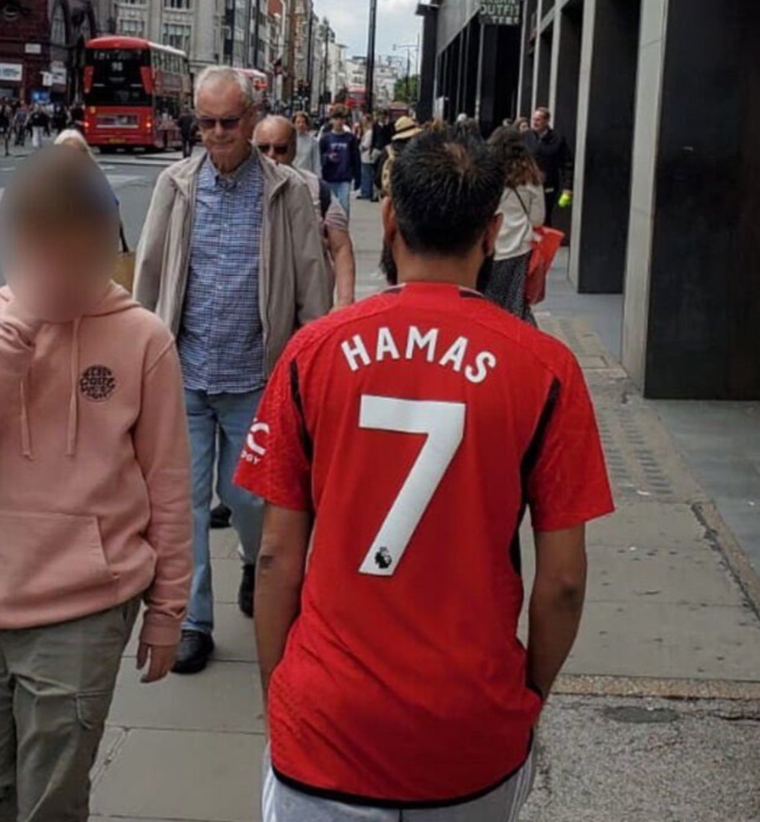 Man walks down London’s Oxford street wearing a ‘Hamas 7’ t-shirt- referencing the October 7th attack.