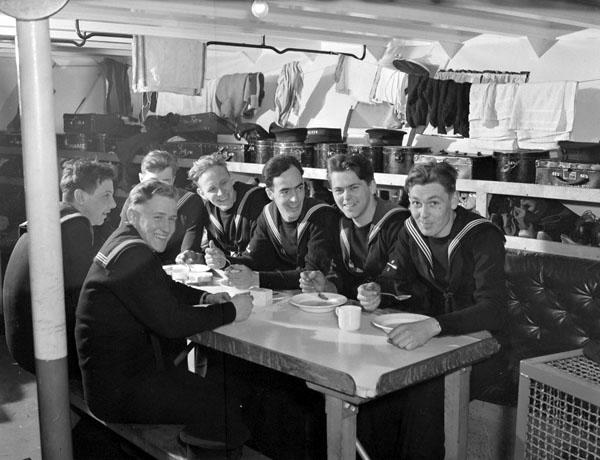 Unidentified ratings eating a meal aboard HMCS AGASSIZ, Esquimalt, British Columbia, Canada, February 1941. (LAC a139897-v6) #RCN #History