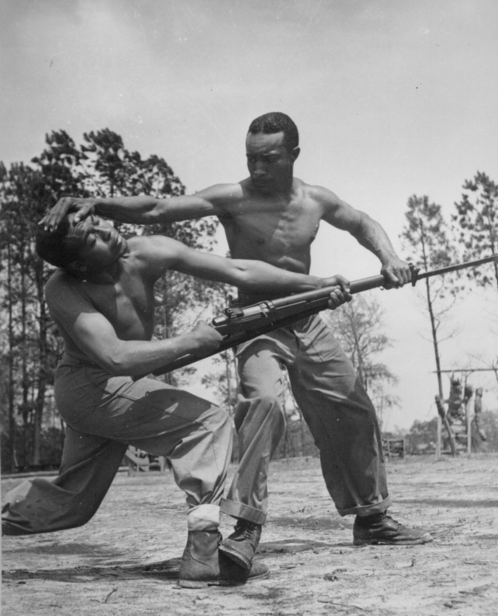 US Marine Corps Corporal Arvin Lou Ghazlo giving judo instructions to Private Ernest C. Jones, Montford Point Camp, North Carolina, United States, Apr 1943