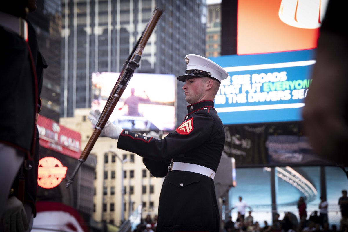 USMC's tweet photo. #Marines with the Marine Corps Silent Drill Platoon perform during the “Once a Marine, Always a Marine” formation in Times Square as a part of @FleetWeekNYC, May 22. https://t.co/DtWBUEowqp
