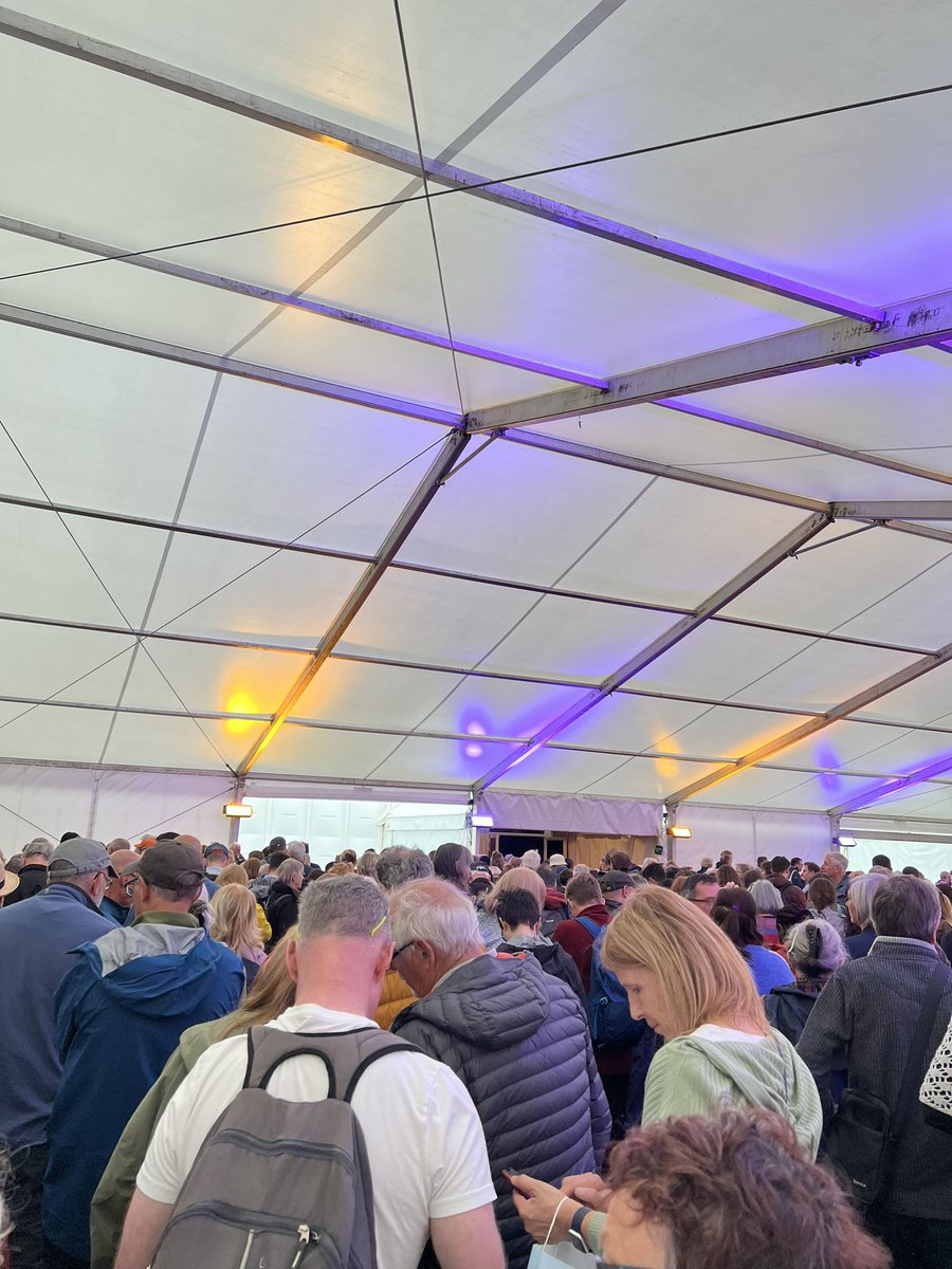 I think @mrjamesob is going to be popular this afternoon at Hay Festival judging by the queue. Just hope we can hear him over the torrential rain hitting the roof 📖☔️
