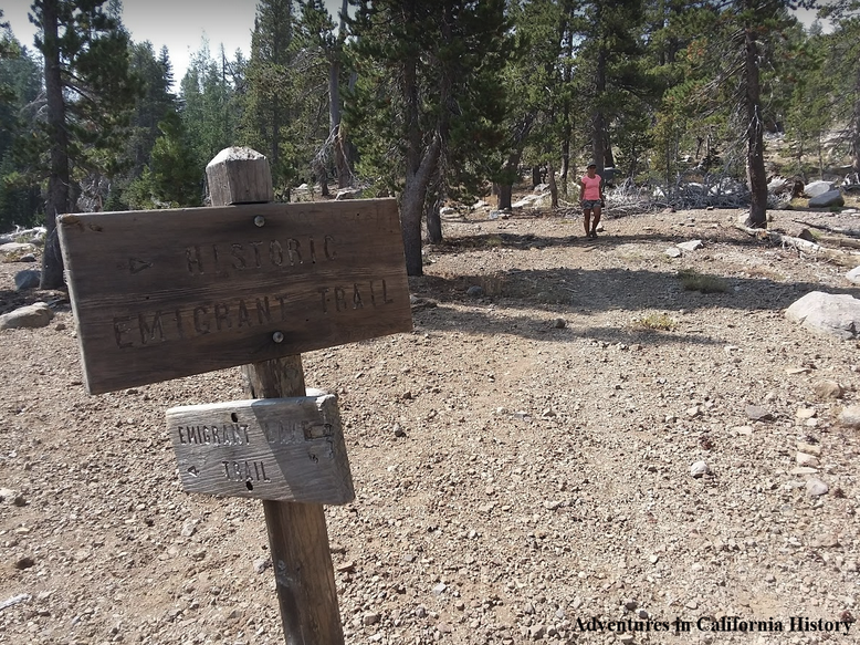 Monica stands on the Emigrant Trail, just 100 feet from Caples Lake,  where the photo I posted yesterday was taken. Tens of thousands of emigrants walked this path with their wagons, headed toward the 'first summit' at Melissa Coray Peak. The trail here is not too steep, but