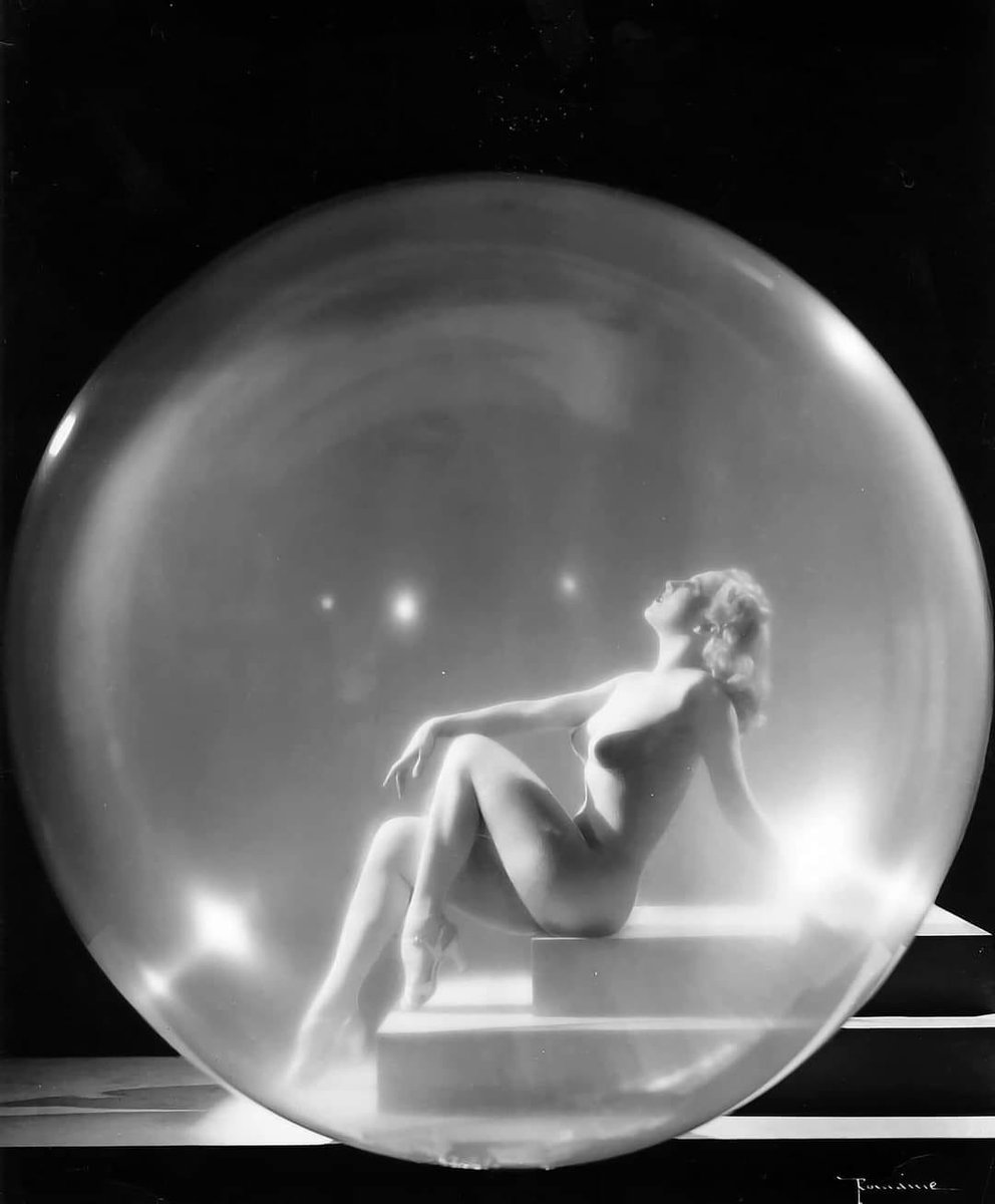 Miss Sally Rand appears to be posing inside her famous bubble. Clever photograph by Maurice Seymour, 1930s.