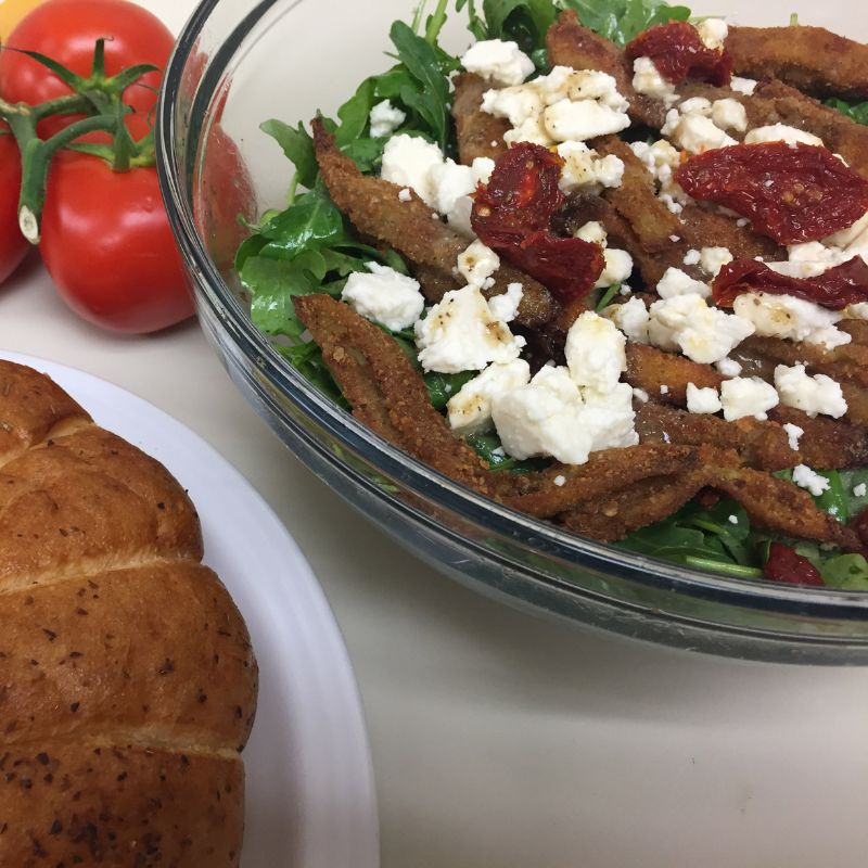 Dominex #EggplantFries make the perfect salad topper. This refreshing salad combines the taste of arugula, feta, & our delicious Dominex Italian-breaded Eggplant Fries. Make this your main meal or a companion salad. Get our recipe at DominexRecipes.com. #Dominex  #Vegetarian