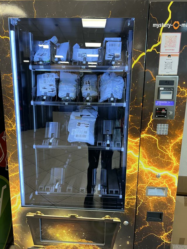 This train station has a mystery vending machine where you can buy whatever is in the unclaimed packages from delivery lockers