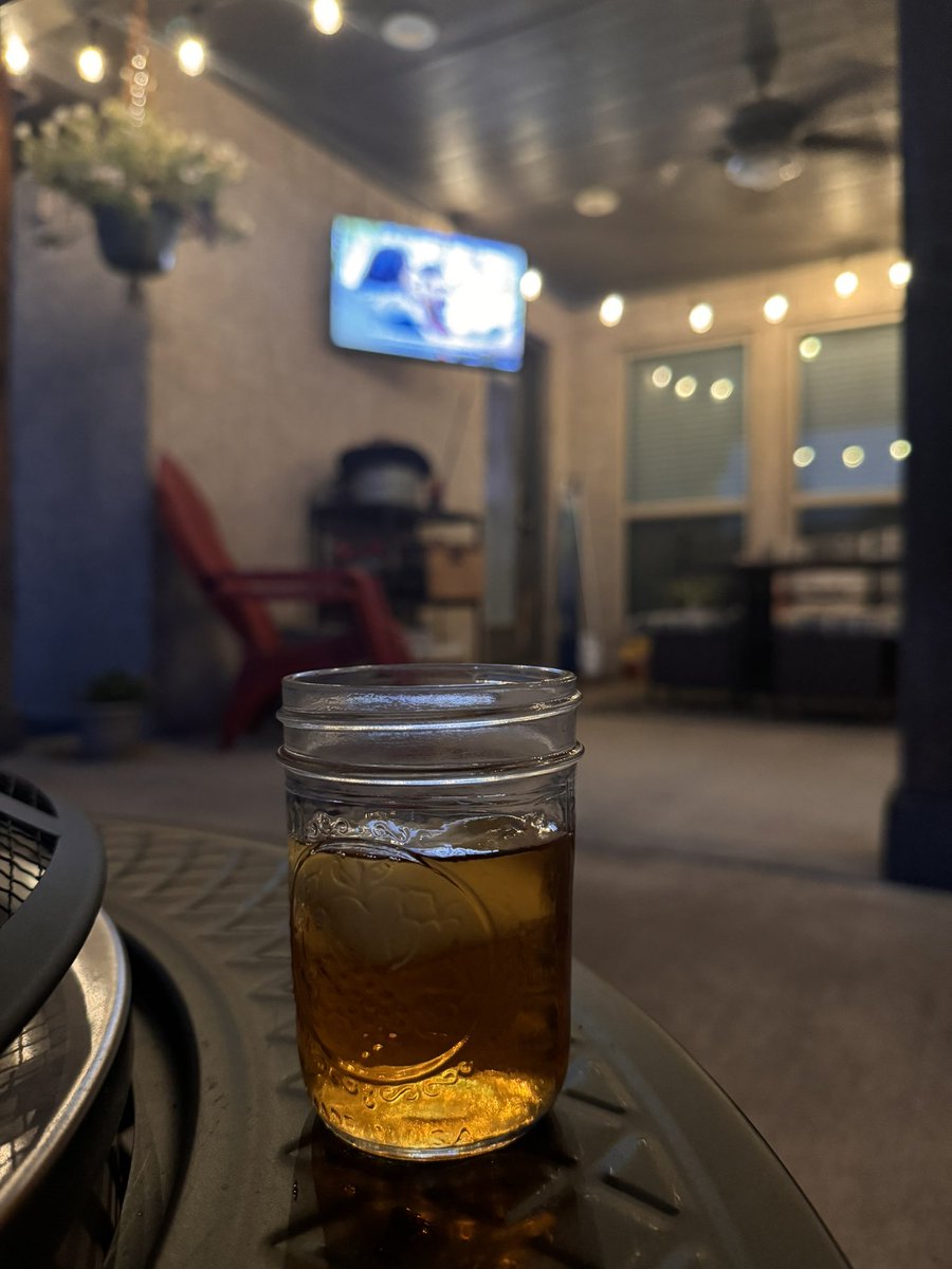 A glass of <a href="/TXWhiskey/">TX Whiskey</a> (in a Mason Jar) on the back porch, watching the Mavs, and listening to Waylon and Willie