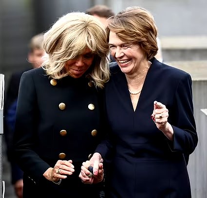 Brigitte Macron and Germanys First Lady LAUGH as they share a joke while they walk through Berlin’s Holocaust Memorial as their husbands lay a wreath for the 6 million Jews who lost their lives.