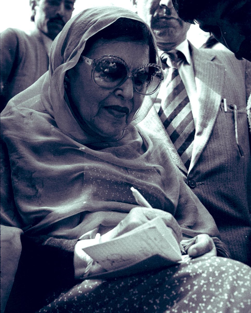 ~From the Nawa-I-Subh archives. Begum Akbar Jahan Abdullah autographing a Party worker's diary.
