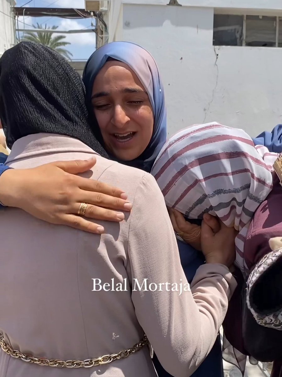 Three Palestinian sisters in Gaza consoling each other this morning on the killing of their fourth sister by Israeli occupation forces.